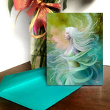 Illustrated art card in flowing watery blues and greens featuring Mystreille of the Elemental Realm, by Primal Painter. Blue envelope