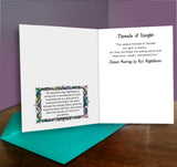 Open card with text and decorative elements on a wooden surface with a purple background