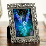 Framed artwork of a dreamy fairy with blue wings against an Art Nouveau background; art by Primal Painter. 