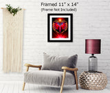 Red root chakra art print with a red angel with intricate wings inside an orb of power with grounding light ray at the bottom called Primal by Primal Painter. Framed hanging over a chair, 11x14