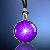 handmade chakra necklace featuring a bright purple starburst art print sealed under glass and representing the  third eye chakra
