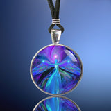 purple angel art pendant necklace in a round silver setting against a blue background with chakra symbolism
