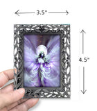 Framed artwork of a fairy with dimensions indicated