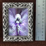 Decorative frame with a fairy illustration with a ruler for size on a brown background