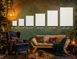 A styled living room scene showing six white poster or canvas mockups mounted on a textured green wall, each labeled with different sizes ranging from 8" x 10" to 30" x 40". The room includes a blue velvet armchair, a beige sofa with patterned pillows and a teal throw blanket, a round wooden coffee table with a plant, and warm string lights and lamps.