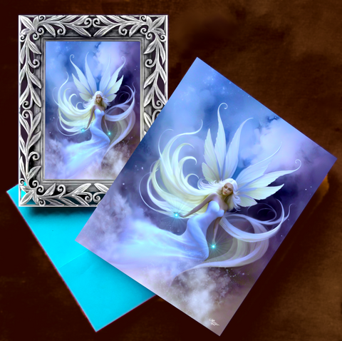Framed artwork of a dreamy fairy in the clouds with white hair and wings, along with a matching story greeting card by Primal Painter. 