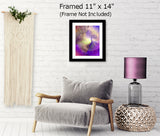 Angel art print with swirling violet, orange, and purple sunburst rays emanating from a purple angel with wispy wings entitled "The Clearing" in the goddess series of energy art by Primal Painter displayed in a black frame over a chair