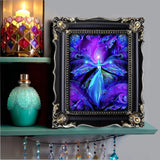 third eye art for intuition in purple and teal featuring a teal angel with spread arms against a patterned background by Primal Painter framed on a bohemian shelf