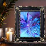 Abstract art print of a blue and purple flower-like winged design called The Unfurling by Primal Painter. Framed on a shelf with a candle