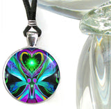 Handmade necklace featuring colorful energy art sealed under a glass dome by Primal Painter of twin flame angels hand in hand under a green heart