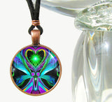 Twin flame necklace called Unconditional Love in a round copper setting and set under a glass dome