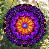 Back view: Textured glass mandala suncatcher featuring violet flame mandala artwork by Primal Painter in vivid purple, reds and orange. 