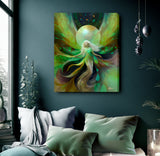 A vertical canvas wall art print featuring an abstract fantasy fairy design in vibrant green, yellow, and teal tones, displayed on a dark teal wall above a bed with pillows. Viridia the Everseed by Primal Painter