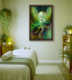 A framed fantasy art print of a glowing fairy with green wings, hanging on a wall above a spa treatment bed in a serene, softly lit room. The Eternal Becoming by Viridia the Everseed. 
