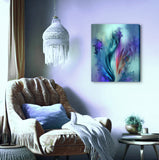 Canvas art print by Primal Painter featuring an abstract impressionist floral print of irises in watercolor style with blues, purples, and teals. Hanging over a cozy chair