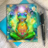 Colorful greeting card with a frog  in a meditation pose and surrounded by flowers. Illustration by Primal Painter.