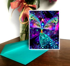 A brightly colored greeting card featuring a chakra angel image with vibrant rainbow colors and a butterfly silhouette, placed on a teal background with a white border. Art by Primal Painter