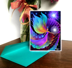 A greeting card featuring a colorful chakra angel art design with a shimmering, multicolored background and a white border. Art by Primal Painter