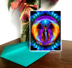 A greeting card featuring a colorful abstract angel artwork with a rainbow-colored aura, displayed on a table with a decorative ribbon in the background. Art by Primal Painter