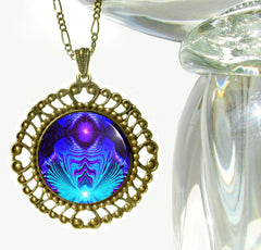large round bronze necklace with blue, purple and teal geometric art sealed under a glass dome by Primal Painter