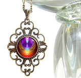 diamond shaped fancy necklace featuring chakra art encased in angel wings