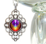 diamond shaped fancy necklace featuring chakra art encased in angel wings