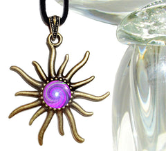 A bronze-colored necklace with a sun-shaped pendant featuring a violet and white spiral chakra design, attached to a black suede faux leather cord with an antique bronze finished pewter art deco style hook and eye clasp by Primal Painter.
