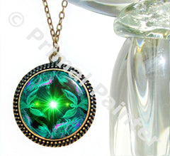 large bronze necklace with a twin flames angel art print by Primal Painter in green heart chakra colors and sealed under glass