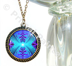 A purple and teal reiki energy necklace with a round bronze-finished brass alloy pendant featuring an abstract print, attached to a bronze-finished curb chain by Primal painter.