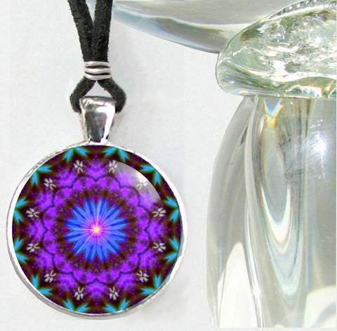 Purple mandala wearable art necklace in a silver finished round setting  with a blue starburst center and third eye chakra symbolism 
