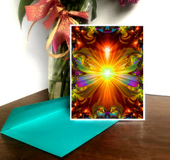 Greeting card featuring a bright orange nad yellow Light Being with a blue envelope on a table. Art by Primal Painter. 