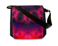 psychedelic red, purple and black abstract art by Primal Painter printed on a messenger bag with a black strap. 